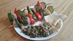 shish kebabs with tabouleh and pita bread